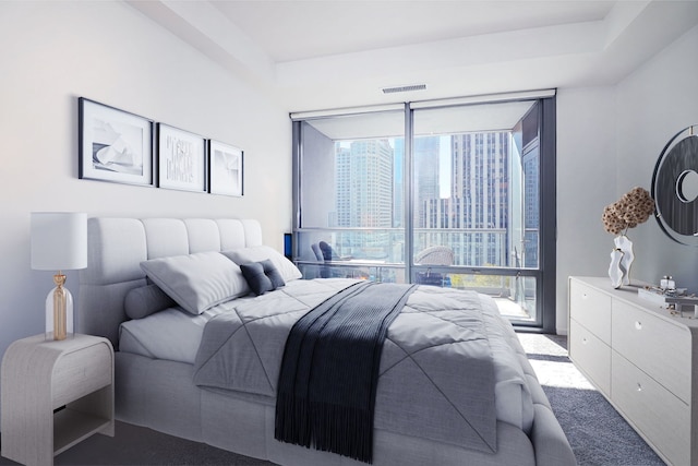 carpeted bedroom featuring multiple windows