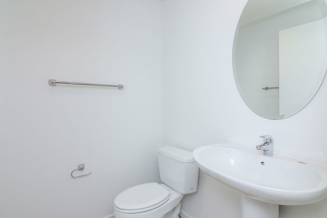 bathroom featuring sink and toilet