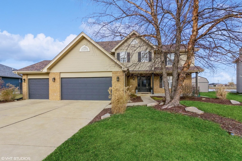 front of property with a front yard and a garage