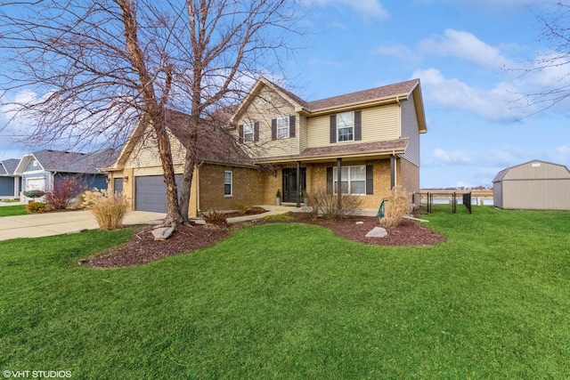 front of property with a front yard, a garage, and a storage shed