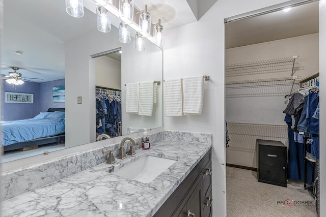 bathroom with ceiling fan and vanity