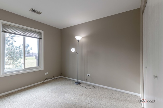 empty room featuring light colored carpet