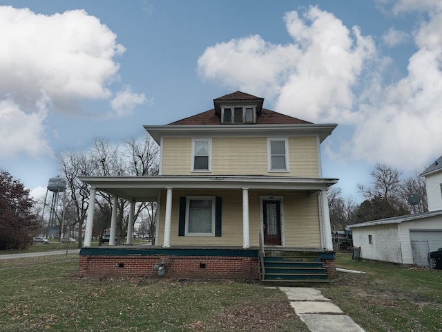 view of front of property featuring covered porch and a front yard