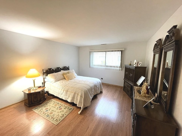 bedroom featuring wood-type flooring