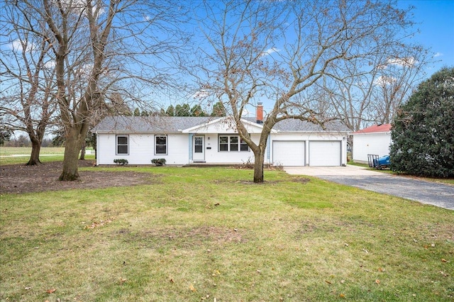 single story home with a front lawn and a garage