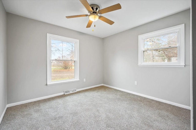 empty room with carpet and ceiling fan