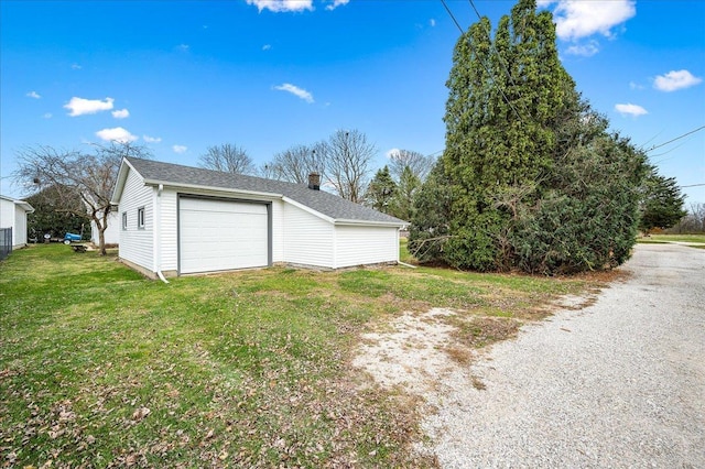 garage with a yard