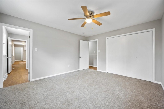 unfurnished bedroom featuring carpet flooring, ceiling fan, and a closet