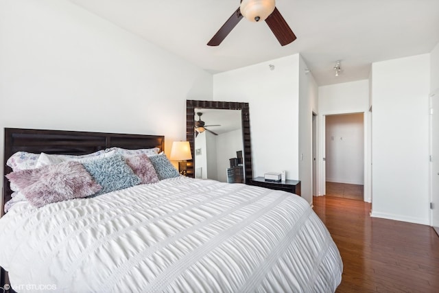 bedroom featuring lofted ceiling, ceiling fan, and dark hardwood / wood-style floors