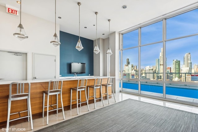 kitchen featuring a breakfast bar and pendant lighting