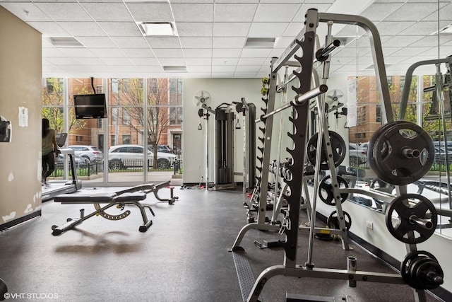 workout area featuring a drop ceiling