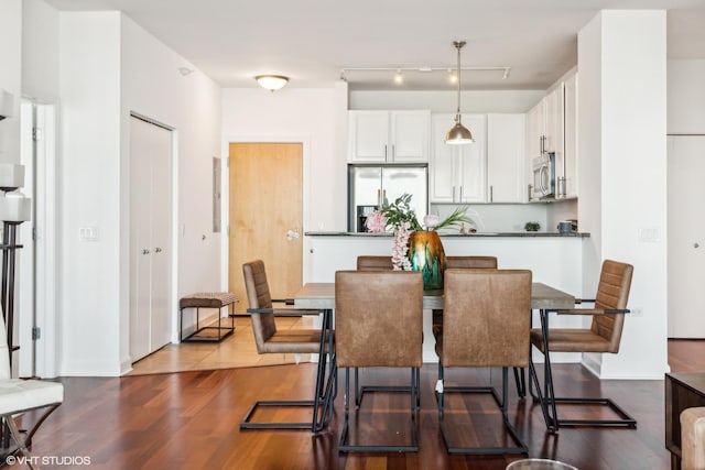 dining area featuring hardwood / wood-style flooring