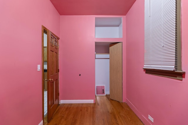 hallway featuring hardwood / wood-style floors