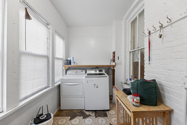 clothes washing area featuring washing machine and clothes dryer