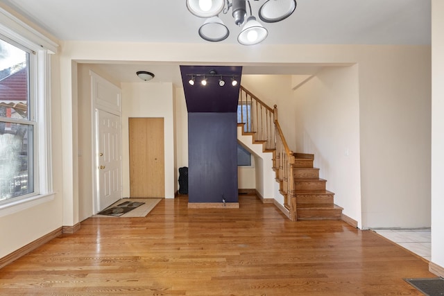 foyer entrance with light wood-type flooring