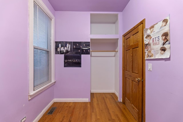 hallway with light wood-type flooring