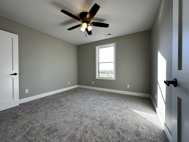 empty room featuring carpet flooring and ceiling fan