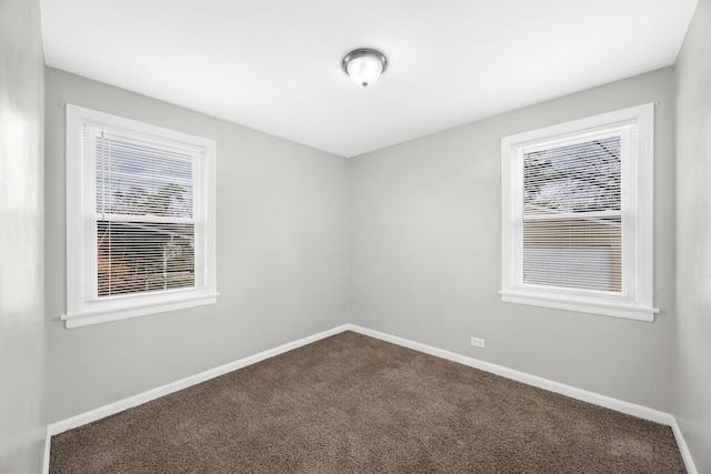 empty room featuring carpet flooring