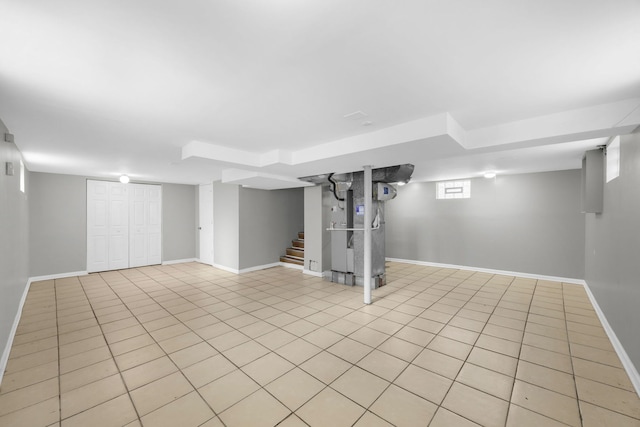 basement with light tile patterned flooring