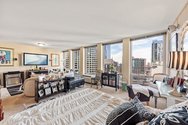 carpeted living room featuring floor to ceiling windows