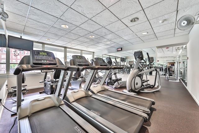 workout area featuring a drop ceiling