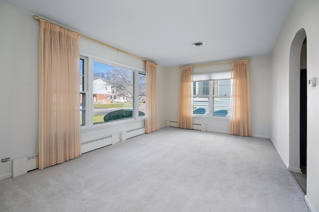 empty room with light colored carpet