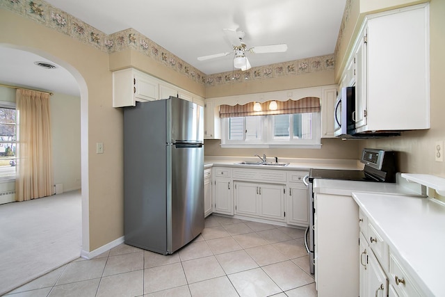 kitchen featuring white cabinetry, sink, ceiling fan, and appliances with stainless steel finishes