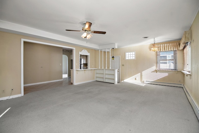 empty room featuring ceiling fan, light carpet, and a baseboard heating unit