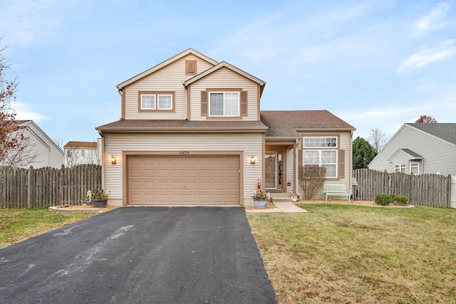 view of front property featuring a garage and a front lawn