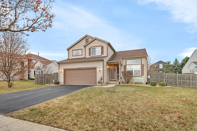 view of front facade with a garage and a front lawn