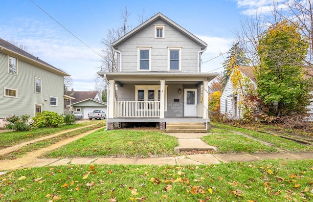 view of front facade with a porch and a front lawn