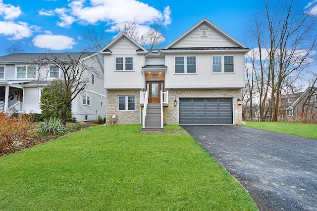 view of front of home with a garage and a front yard