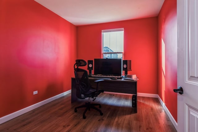 home office with wood-type flooring