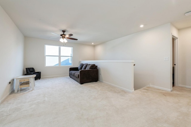 sitting room with light carpet and ceiling fan