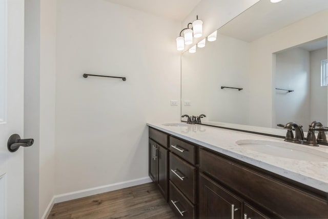 bathroom featuring vanity and wood-type flooring