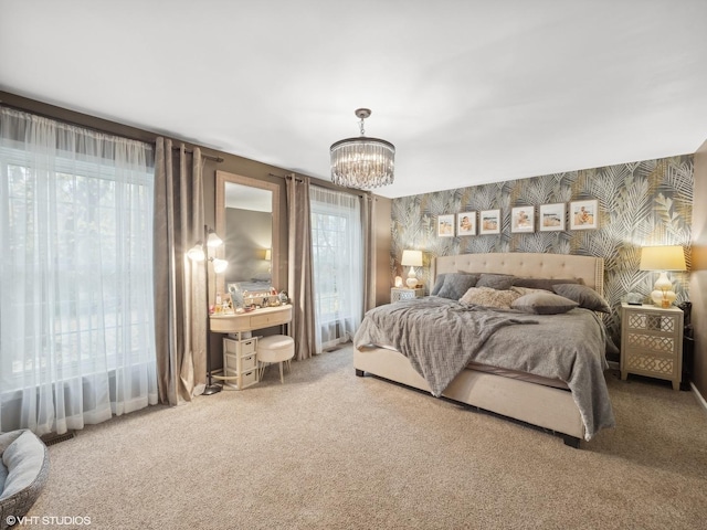 bedroom with carpet and an inviting chandelier