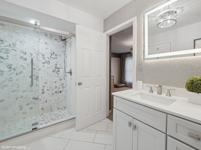 bathroom featuring tile patterned floors, vanity, a chandelier, and an enclosed shower