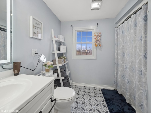 bathroom with tile patterned flooring, vanity, toilet, and a shower with shower curtain