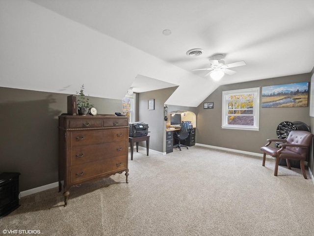 interior space featuring ceiling fan, light carpet, and vaulted ceiling