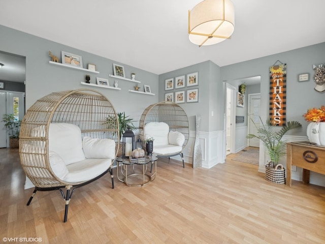 living area with light hardwood / wood-style flooring