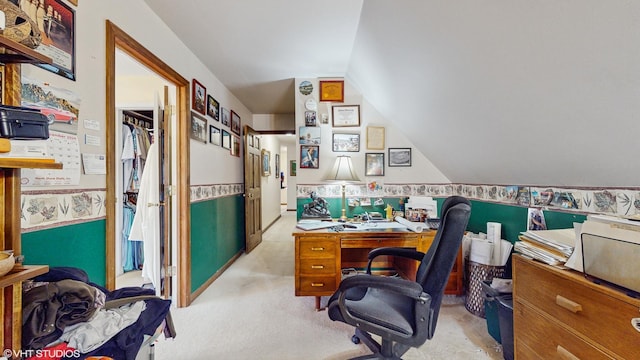 carpeted office space featuring vaulted ceiling