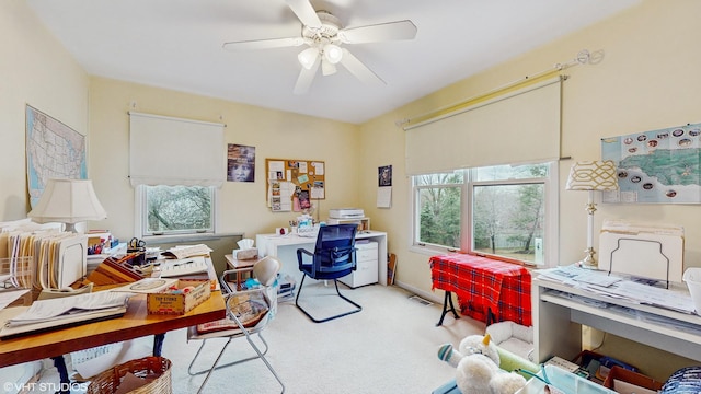 office area featuring light colored carpet and ceiling fan