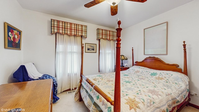 bedroom with ceiling fan and carpet