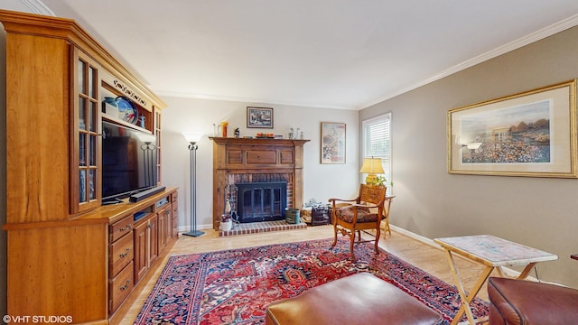 living room featuring crown molding, a fireplace, and light hardwood / wood-style floors