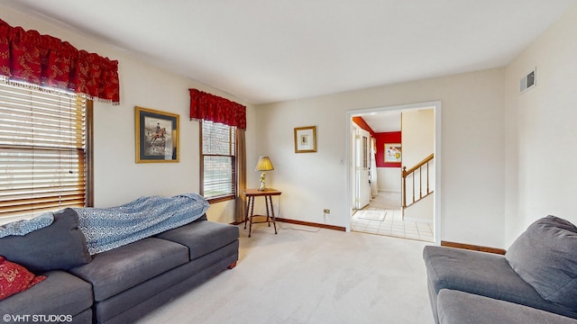 carpeted living room with plenty of natural light