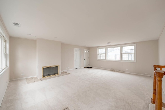 unfurnished living room with light carpet