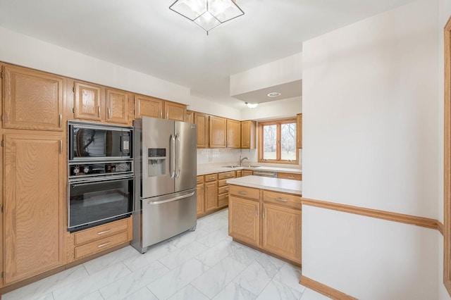 kitchen featuring black appliances and sink