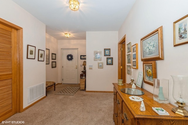 corridor with light colored carpet