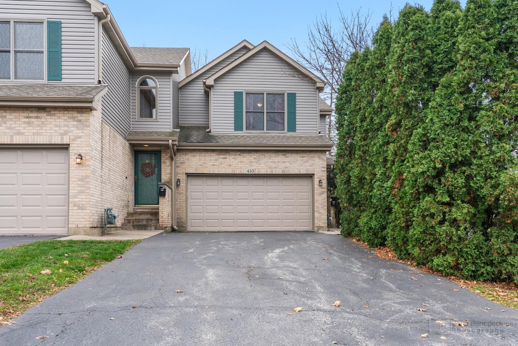 front facade with a garage