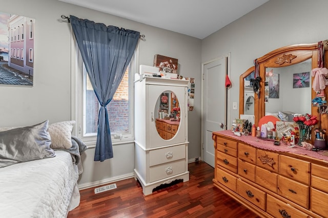 bedroom featuring dark wood-type flooring